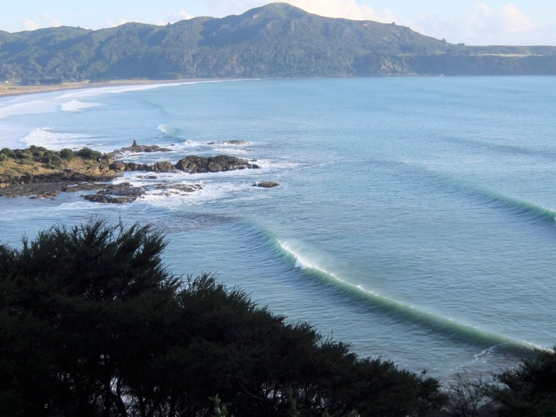 The surf was rolling into remote Hicks Bay