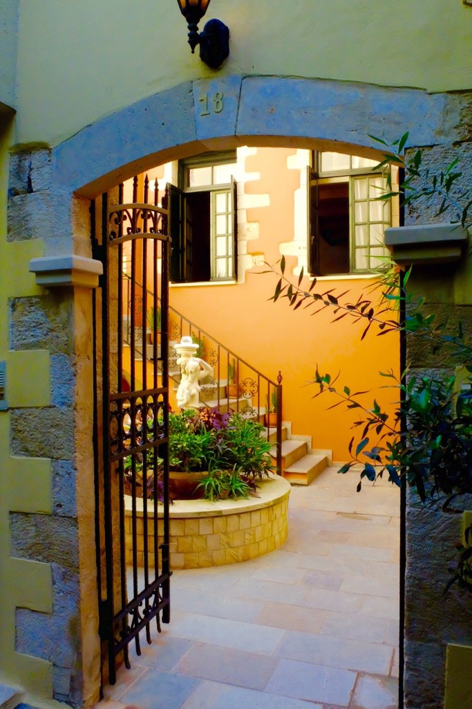 Peaking into the courtyards in Chania