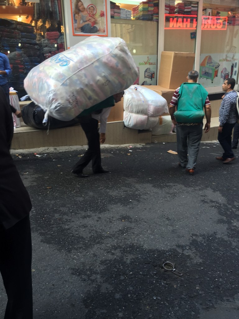 We stmbled into a clothing wholesale area one morning, the main distribution format was two legs, either humping it on the back or on a trolley. It looked like hard work given the steep gradients of the hills.