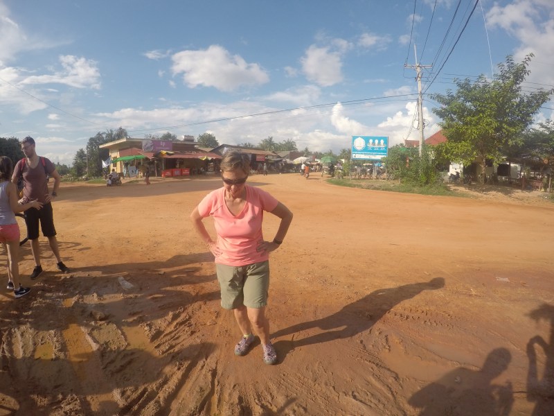 Ruth walks back a little dejected from her browsing in the local market. Mainly fresh produce.